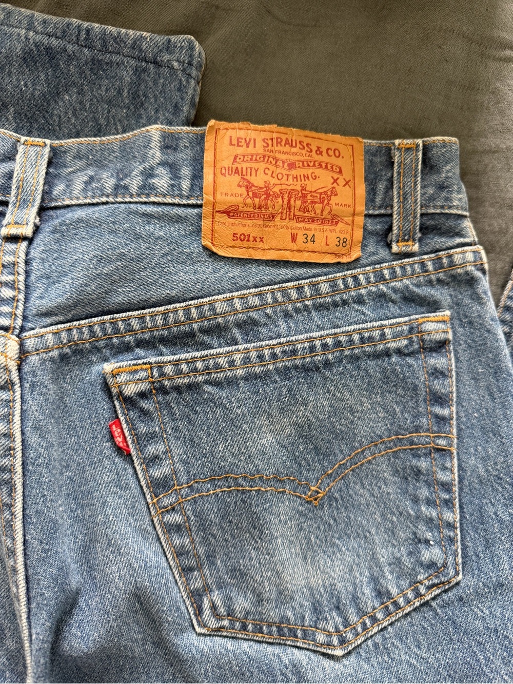 Vintage Levi's 501xx light blue denim jeans with tan leather patch